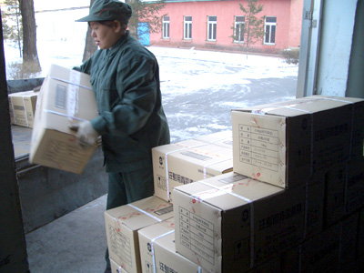 Loading penicillin onto truck in China 